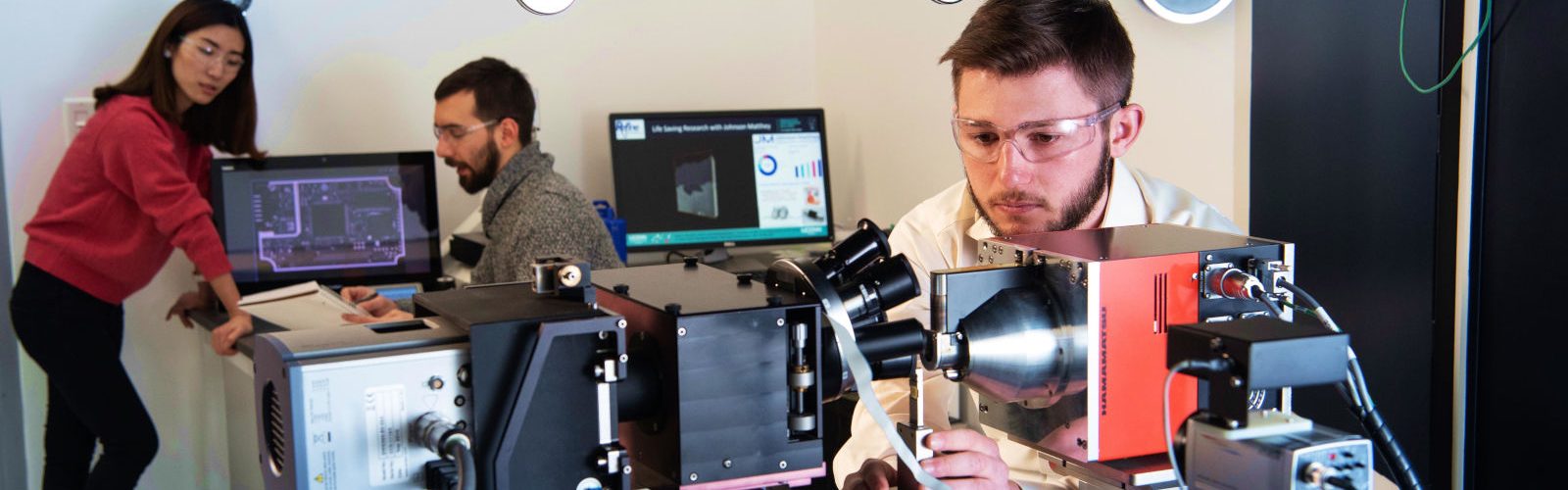 students in laboratory doing research